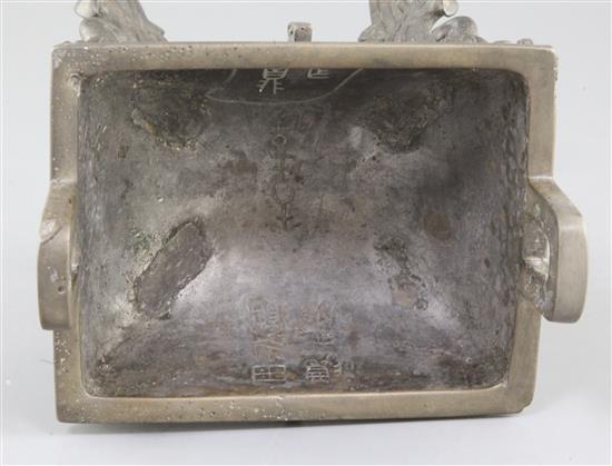 A Chinese archaic bronze quadruped ritual food vessel, Fangding, early Western Zhou dynasty, 22.7cm high, 17.5cm wide, repairs and lack